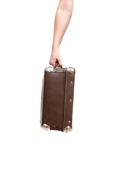 レトロなスーツケースと白い背景に分離された女性の手 — ストック写真