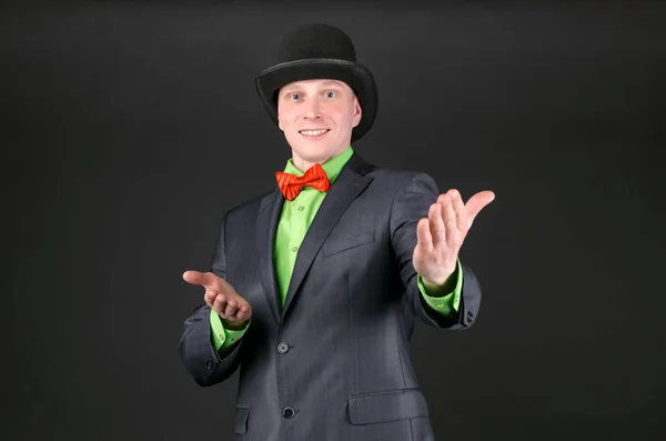 Cheerful Happy Man Bowler Hat Welcomes Presenting Someone Black Background — Stock Photo, Image