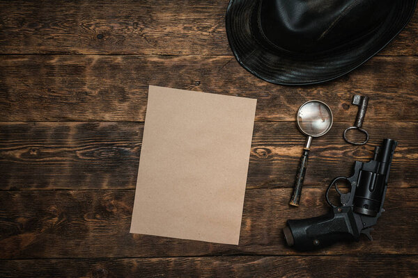 Top secret document paper page template on a wooden table of secret service agent flat lay background.