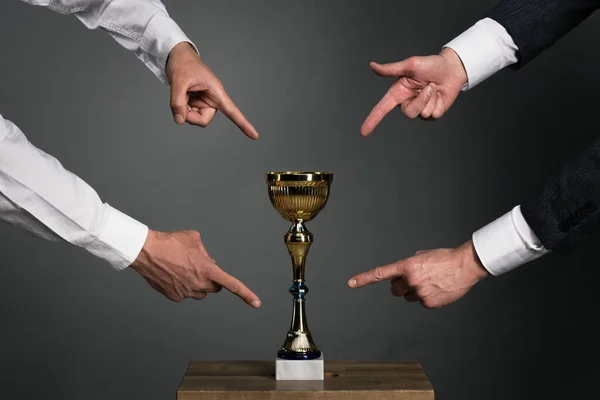 Two Businessmans Showing Index Fingers Golden Cup Award Trophy Chair Stock Photo