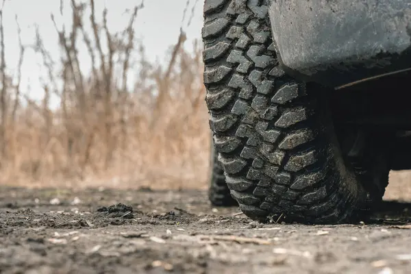 Mud terrain wheel of car close up background.