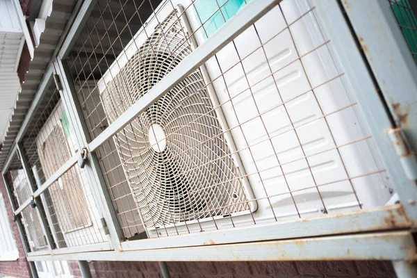 Air conditioner fans on the building wall abstract background.