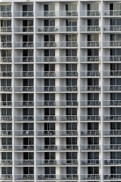 Glass facade with balconies, modern building, no people