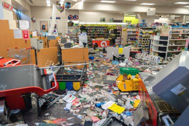CHICAGO, ILLINOIS - MAY 31, 2019: CVS Pharmacy store interior destroyed by the protesters after nights of riots, looting and chaos in Downtown Chicago clipart