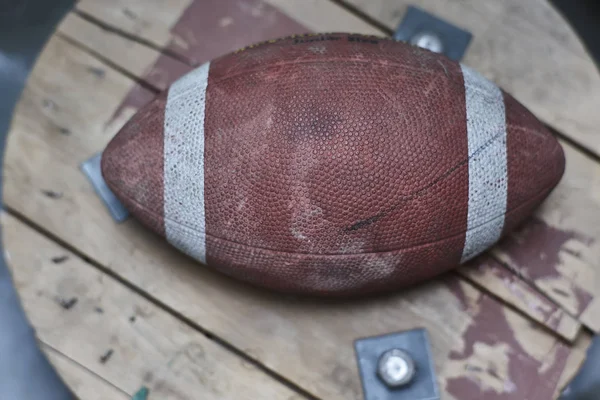 Detail of a vintage football ball with all the signs of time and wear.