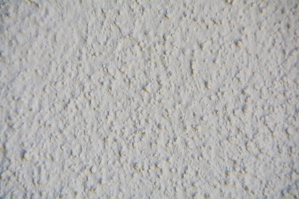 Tekstura Porcji Białej Ściany Ziarnami Widocznymi Falami — Zdjęcie stockowe