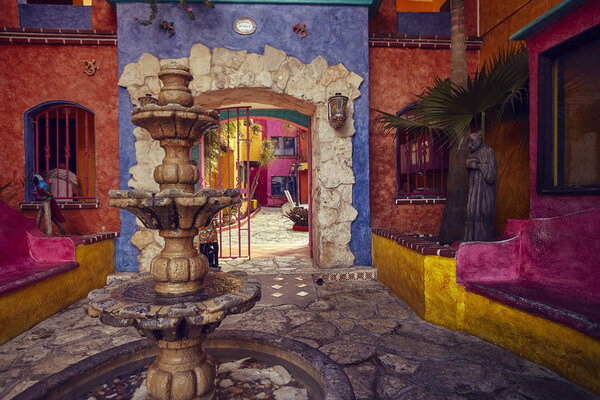 A colorful courtyard with a marble fountain in the foreground: an example of South American architecture.