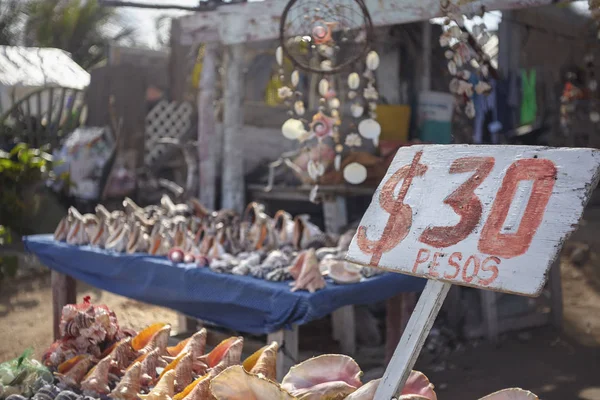 Stock image Signpost with the price of 30 Pesos placed at a stall in Isla Mujeres in Mexico