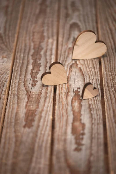 Different Size Heart Figures Wooden Background — Stock Photo, Image