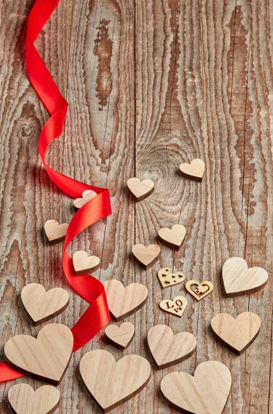 Different Size Heart Figures Red Ribbon Wooden Background — Stock Photo, Image