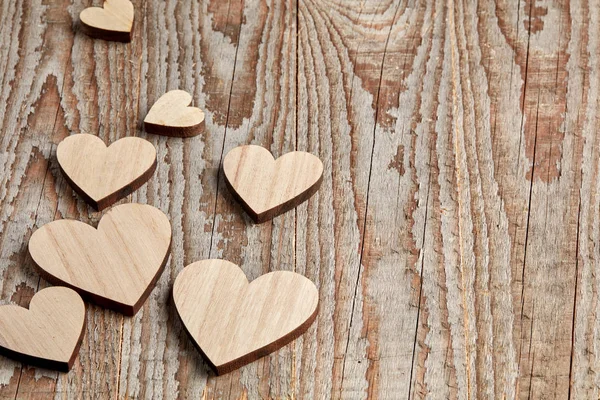 Different Size Heart Figures Wooden Background — Stock Photo, Image