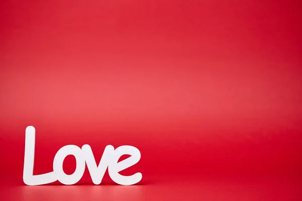 Red background with big white love sign