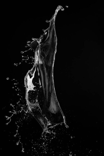 Clear, transparent water splash on black background