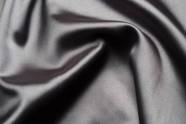 İpek dalgaları ile soyut, zarif arka plan dokusu, satan lüks bez kumaş