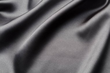 İpek dalgaları ile soyut, zarif arka plan dokusu, satan lüks bez kumaş