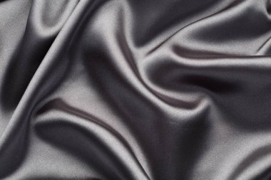 İpek dalgaları ile soyut, zarif arka plan dokusu, satan lüks bez kumaş