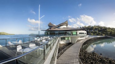 HAMILTON ISLAND, WHITSUNDAY ISLANDS - MAR 17, 2014: The Hamilton Island Yacht Club designed by Walter Barda is often likened to the Sydney Opera House.  clipart
