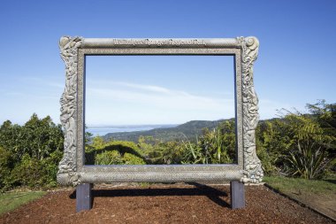 WAITAKERE, NEW ZEALAND - JUNE 14: Giant frame with panoramic view of the Waitakere Ranges. The area is home to kauri snails, glowworms and native long-tailed bats clipart