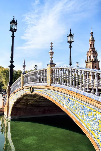 SEVILLE, SPAIN - NOVEMBER 16TH, 2012: One of four ceramic bridges that cross long canal of Plaza de Espana, Ceramic bridges represent four ancient kingdoms of Spain