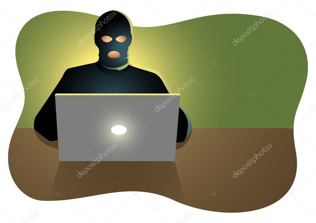 Hacker behind laptop computer