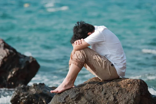 Sorrowful Stressed Asian Man Sit Hug Knees Chest Rock Seashore — Stock Photo, Image