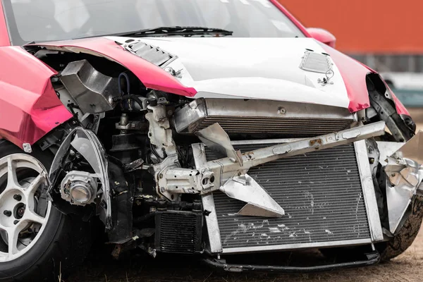 Front view of damaged car crash accident on the road.