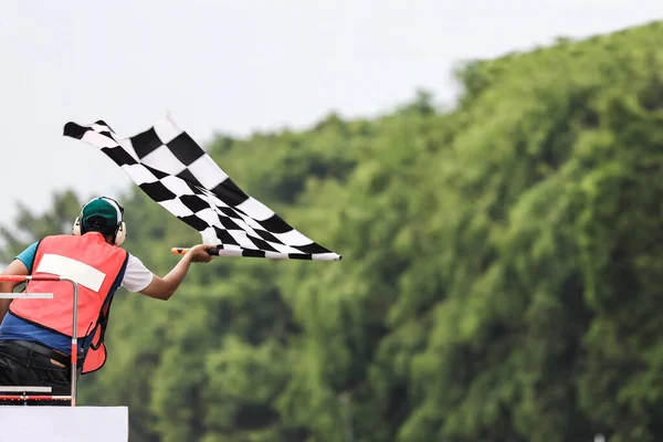 Back View Man Holding Checkered Race Flag — Stock Photo, Image