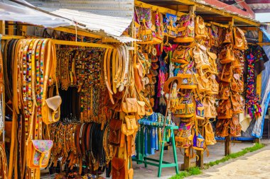View on Indigenous leather handicrafts on market in Oaxaca - Mexico clipart