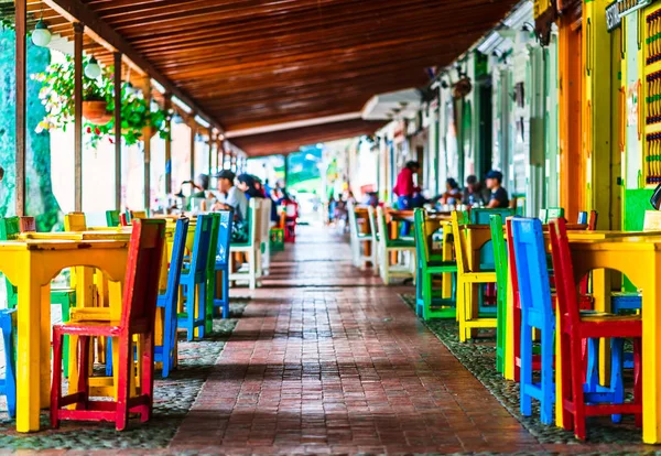 View on colorful chairs and tables from colonial buildings in the village Jerico in Colombia