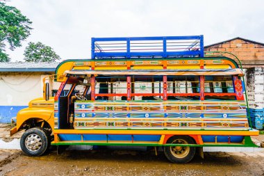 View on Typical colorful chicken bus near Jerico Antioquia, Colombia, South America clipart