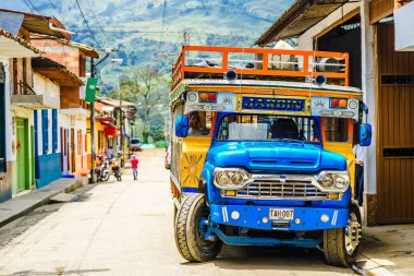 View on typical colorful chicken bus in Jardin, Antioquia, Colombia, South America on 27th March 2019  clipart