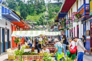Local market with sellers in the streets of the village Salento, on March 23, 2019 - Colombia clipart