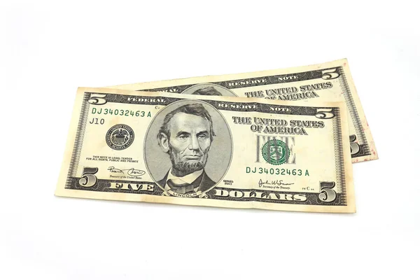 Dólares estadounidenses en efectivo sobre fondo blanco — Foto de Stock