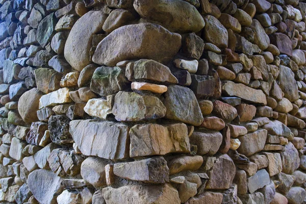 Wall built with the use of river stones