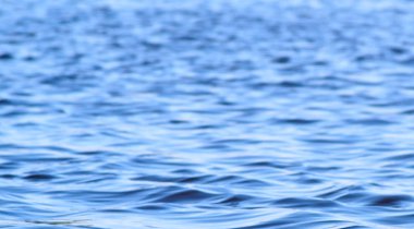 Su dalgaları yakın arka plan. Mavi su arka planı