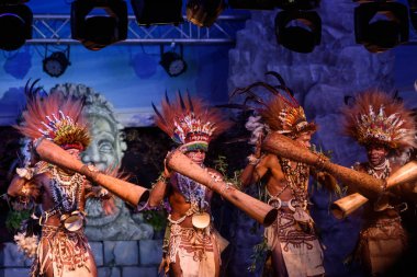 Bergamo, Italy - June 1, 2018: The TUFI group performs in traditional songs and dances of Papua New Guinea, the tribe performed at the festival LO SPIRITO DEL PIANETA at Chiuduno. Brambilla Simone Live News photographer clipart