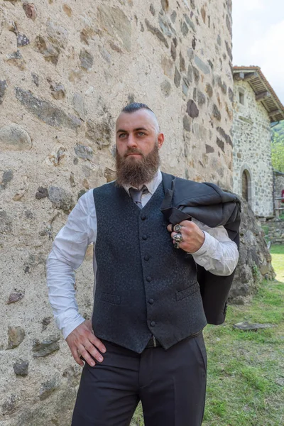 Man Long Beard Wears Dark Elegant Suit Posing Front Stone — Stock Photo, Image