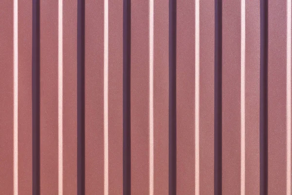 Brown corrugated steel sheet with vertical guides. — Stock Photo, Image