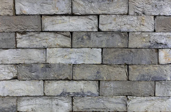 A textura da parede de pedra do tijolo velho. Pedra de construção italiana. Alvenaria histórica . — Fotografia de Stock