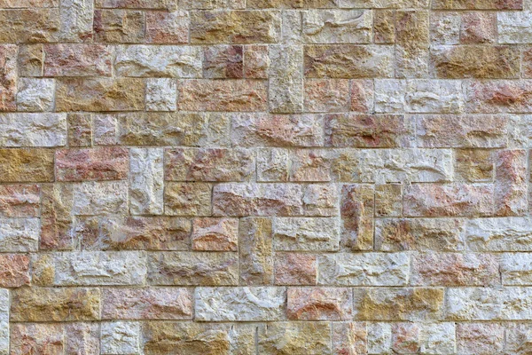 Piedra mosaico multifacético hecho de textura de arenisca de cerca — Foto de Stock