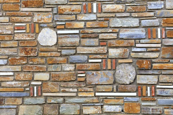 Pedra mosaico multifacetado feito de textura de arenito close-up — Fotografia de Stock