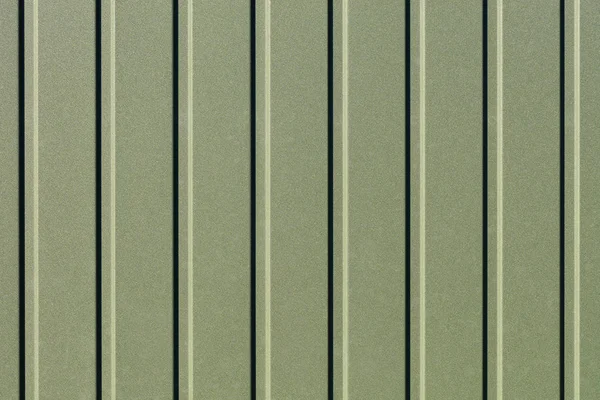 Green corrugated steel sheet with vertical guides. — Stock Photo, Image