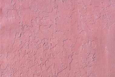 Kırmızı boya ile boyanmış eski duvarın dokusu ve arka planı.