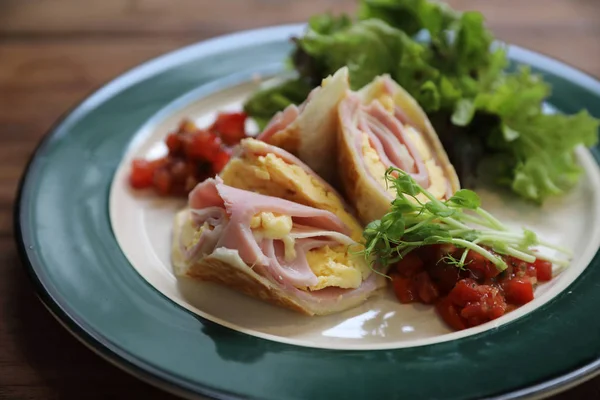 Breakfast burrito ham and eggs with salad vintage style