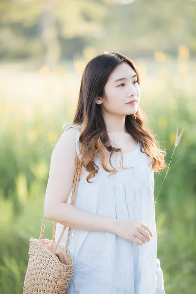 Portrait of Young Asian woman girl smile in flower garden — Stock Photo, Image