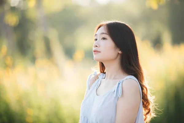 Portrait of Young Asian woman girl smile in flower garden — Stock Photo, Image