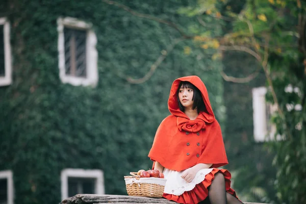 stock image Portrait young woman with Little Red Riding Hood costume