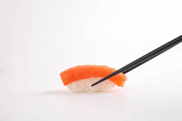 Salmon Sushi Chopsticks Japanese Food Isolated White Background — Stock Photo, Image