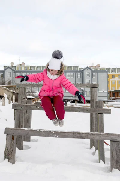 Young Girl Jumping Wooden Bench Snow — Stock Photo, Image