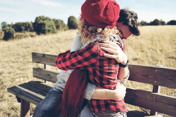 Happy Young Couple Love Hugging Sunbathing Wooden Bench Meadow Autumn — Stock Photo, Image